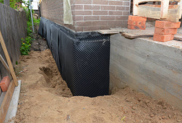 SJ Waterproofing Pros technician performing targeted Waterproofing assessment in Okeana, OH